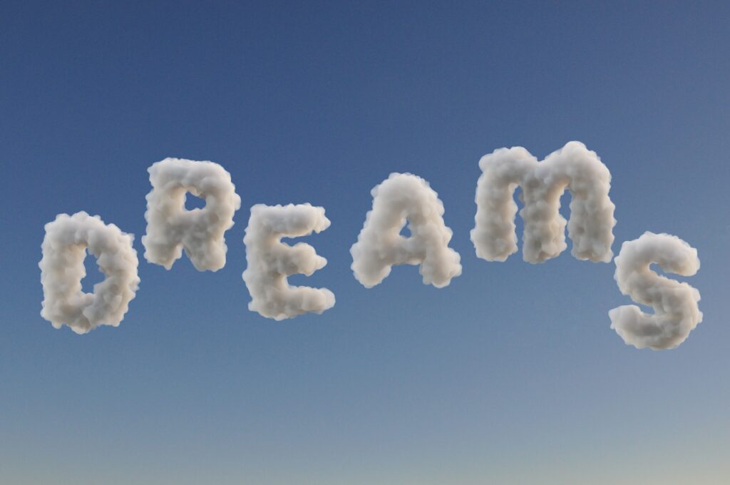Dreams nuages qui forment le mot Dreams dans ciel bleu